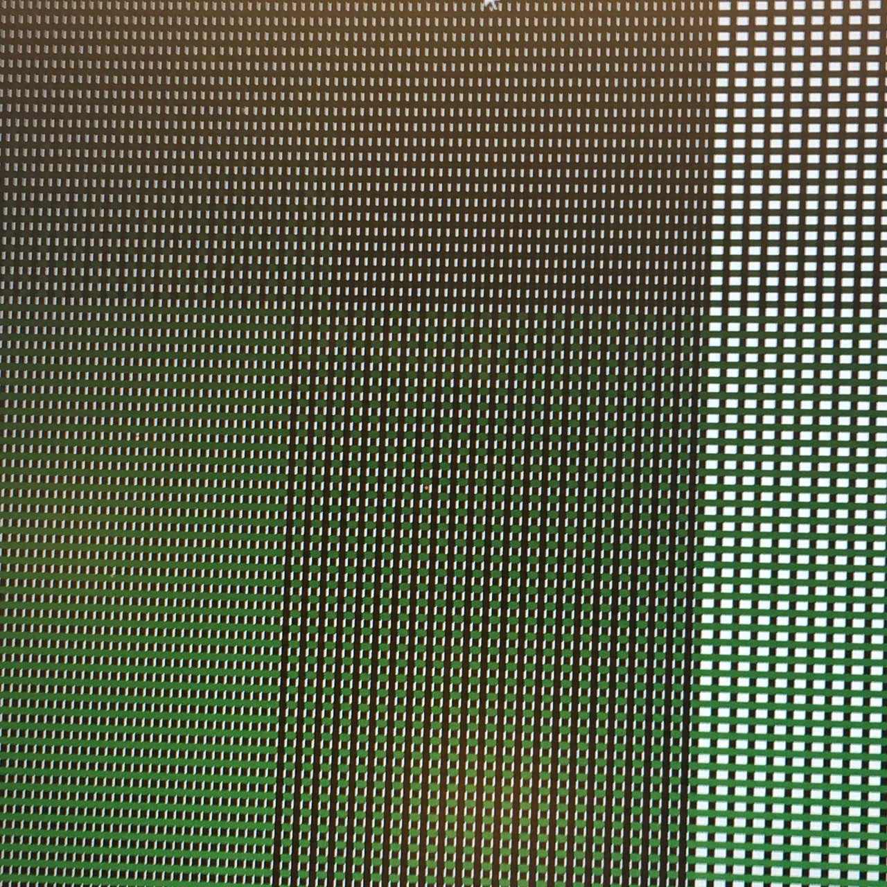 Tweed-like pattern on a computer screen in green, black and white