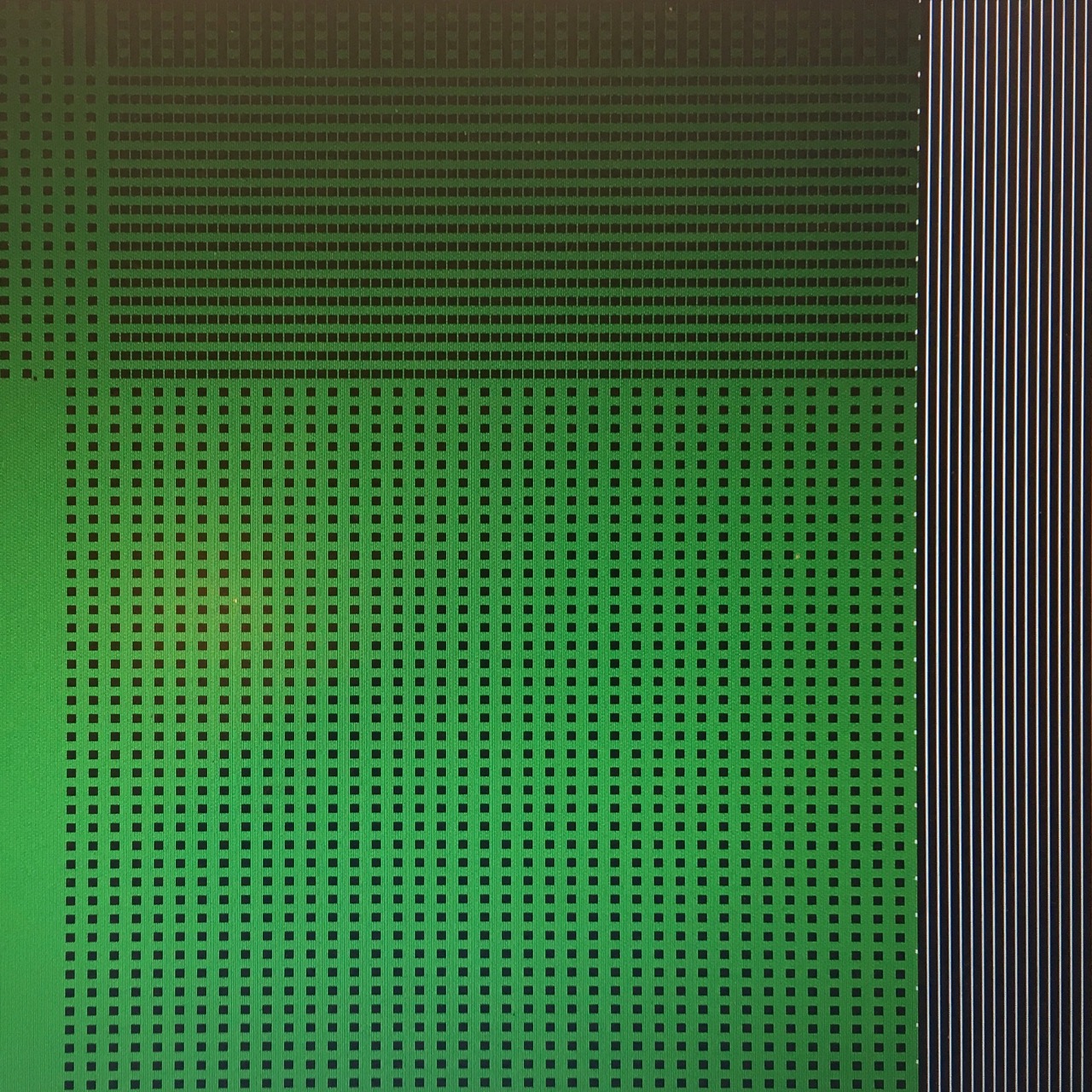 Tweed-like pattern on a computer screen in green, black and white
